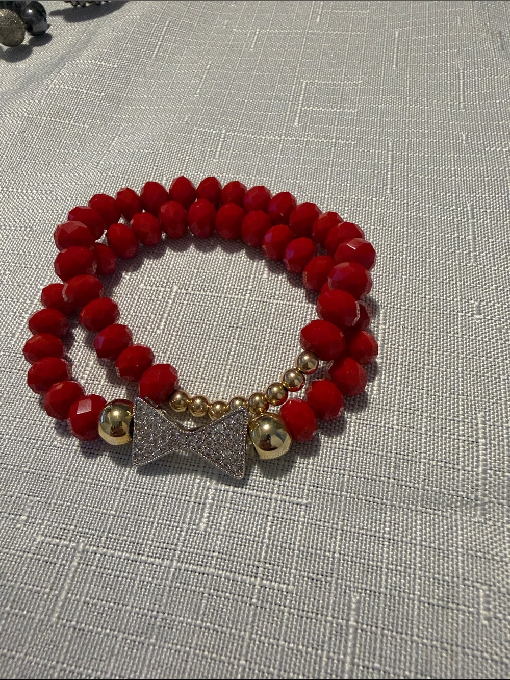 Claire's Red Faceted Bead Bracelet with Gold Bow Accent